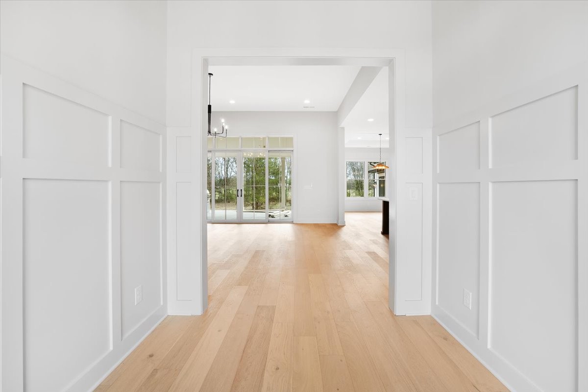 2412 Joe Brown Road Spring Hill, TN 37174 - Photo 3 of 86 a view of an empty room with wooden floor and a window