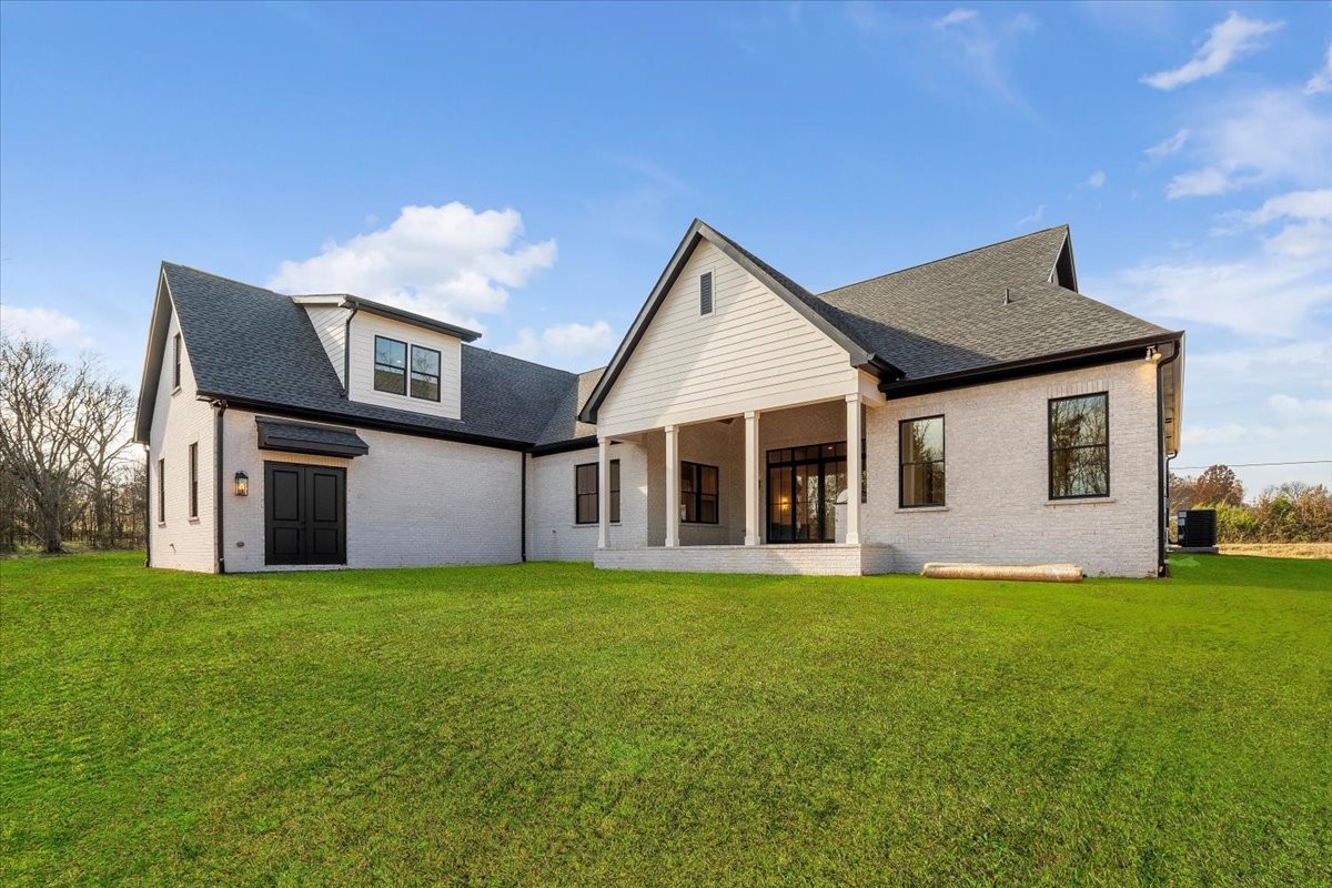 2412 Joe Brown Road Spring Hill, TN 37174 - Photo 31 of 86 a front view of a house with a yard and garage