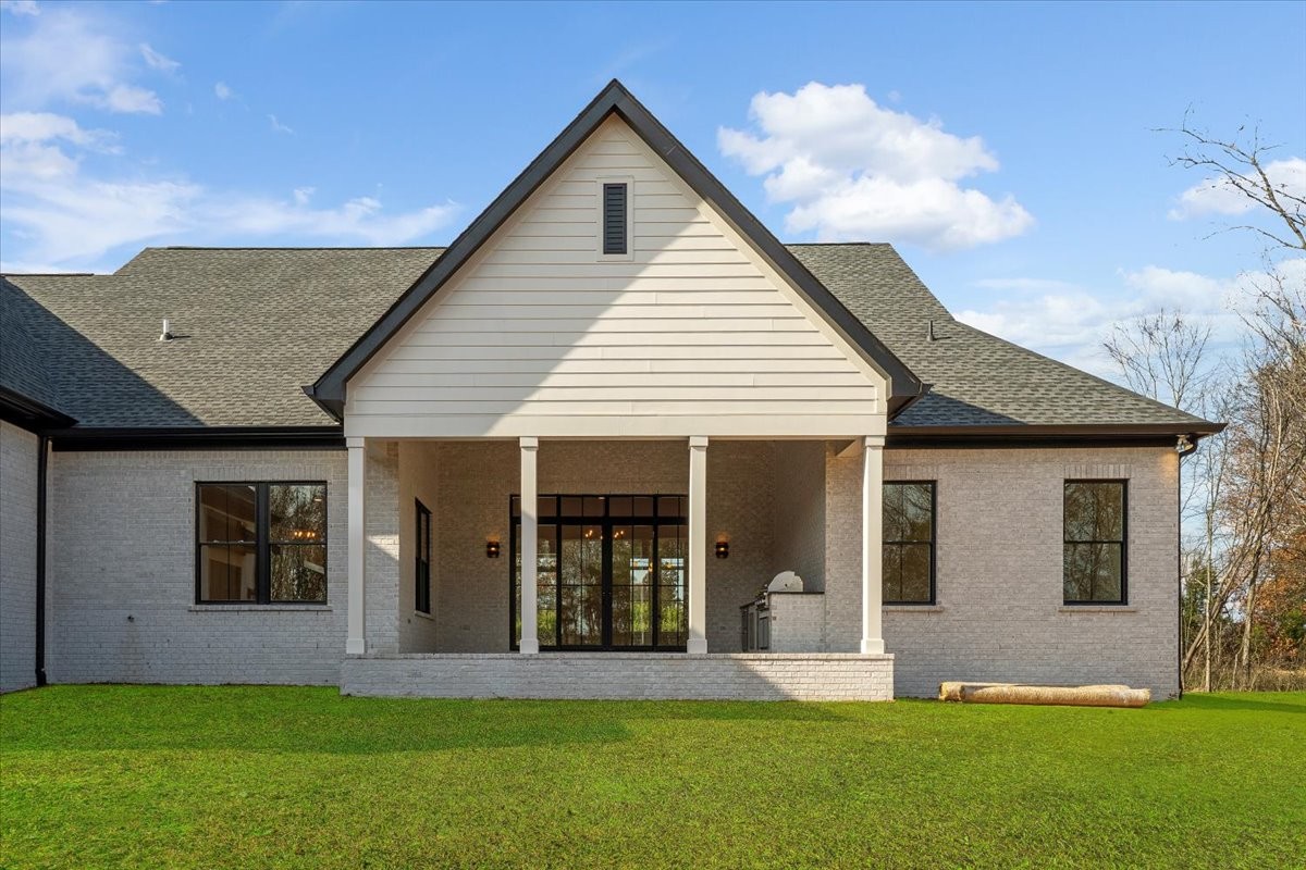2412 Joe Brown Road Spring Hill, TN 37174 - Photo 33 of 86 a front view of a house with a yard and garage