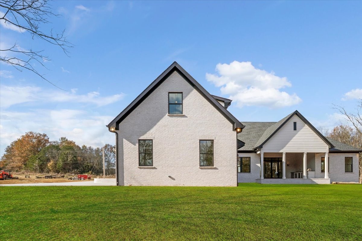 2412 Joe Brown Road Spring Hill, TN 37174 - Photo 35 of 86 a front view of a house with a yard