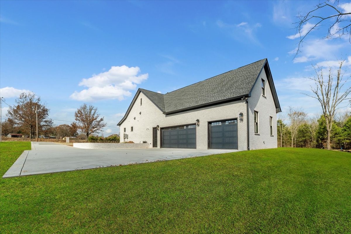 2412 Joe Brown Road Spring Hill, TN 37174 - Photo 37 of 86 a front view of house with yard and green space