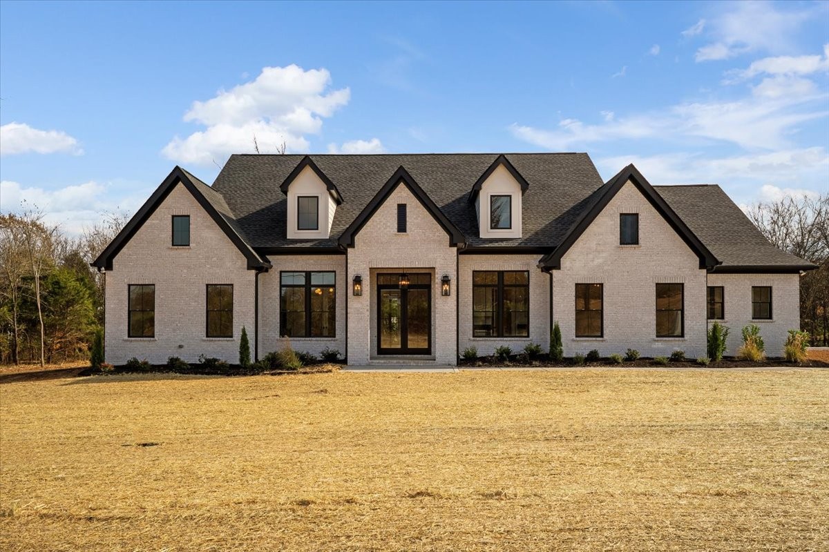 2412 Joe Brown Road Spring Hill, TN 37174 - Photo 45 of 86 a front view of house with yard and trees in the background