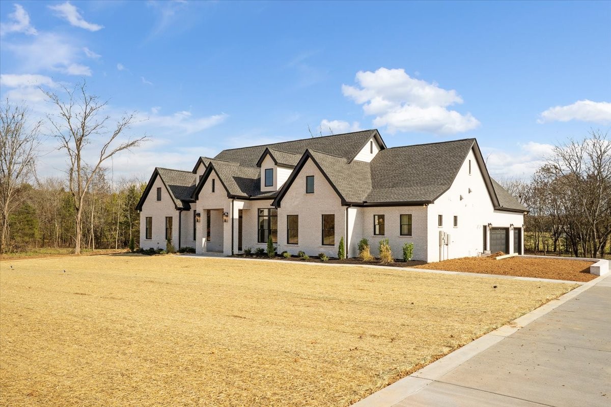 2412 Joe Brown Road Spring Hill, TN 37174 - Photo 46 of 86 a front view of a house with a yard
