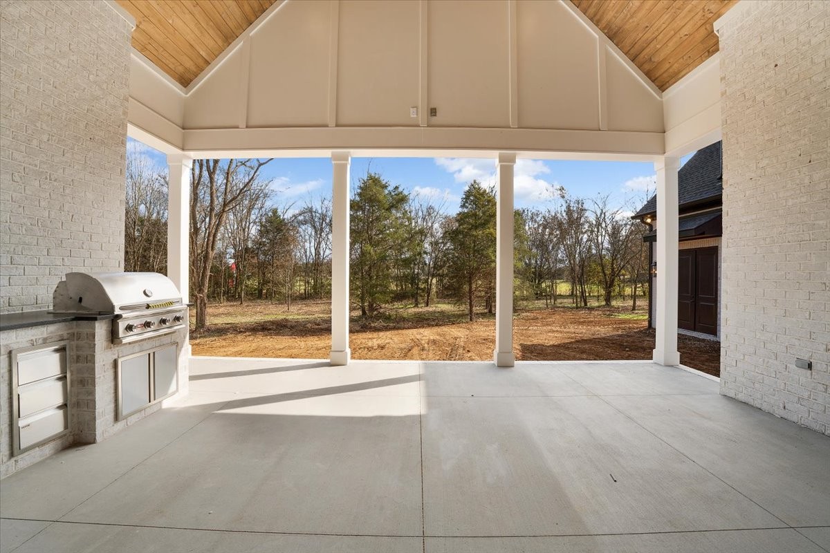 2412 Joe Brown Road Spring Hill, TN 37174 - Photo 57 of 86 a view of an empty room with a fireplace and a window