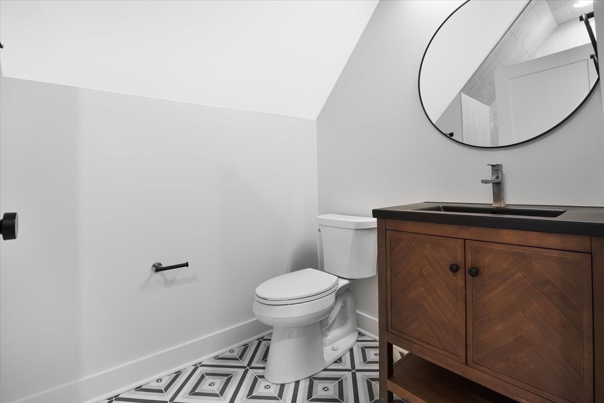 2412 Joe Brown Road Spring Hill, TN 37174 - Photo 62 of 86 a bathroom with a sink and a toilet