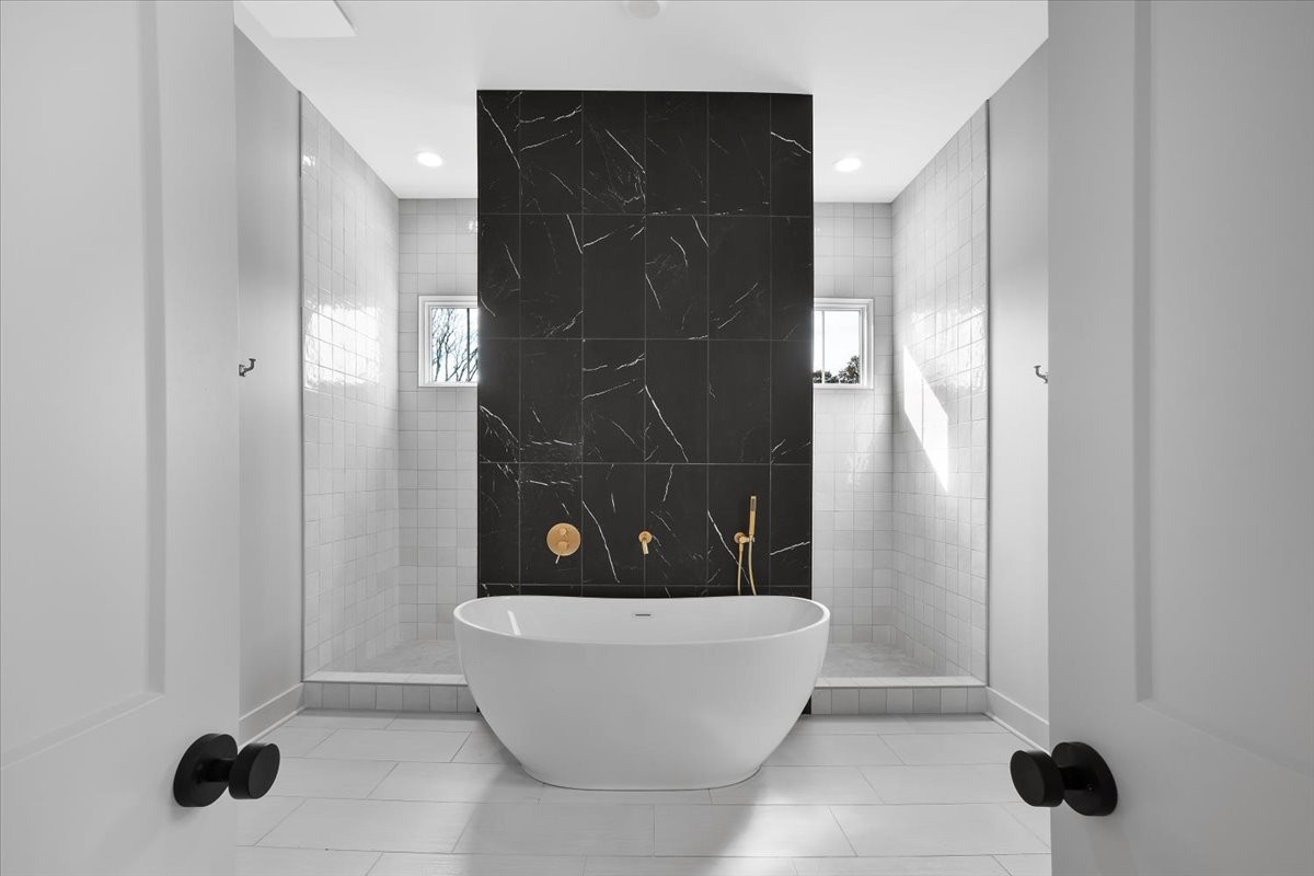 2412 Joe Brown Road Spring Hill, TN 37174 - Photo 72 of 86 a bathroom with a bathtub and shower