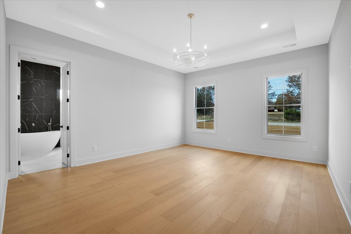 2412 Joe Brown Road Spring Hill, TN 37174 - Photo 73 of 86 a view of an empty room with window and wooden floor