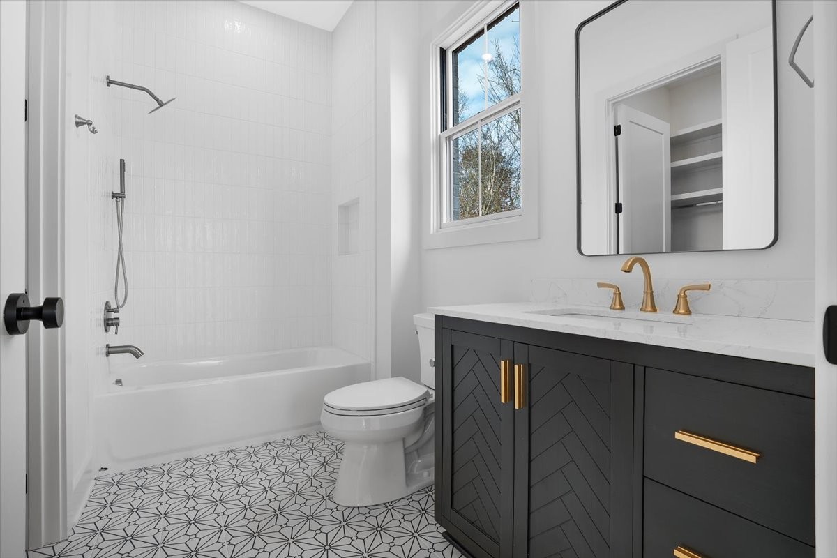 2412 Joe Brown Road Spring Hill, TN 37174 - Photo 85 of 86 a bathroom with a sink toilet a mirror and shower
