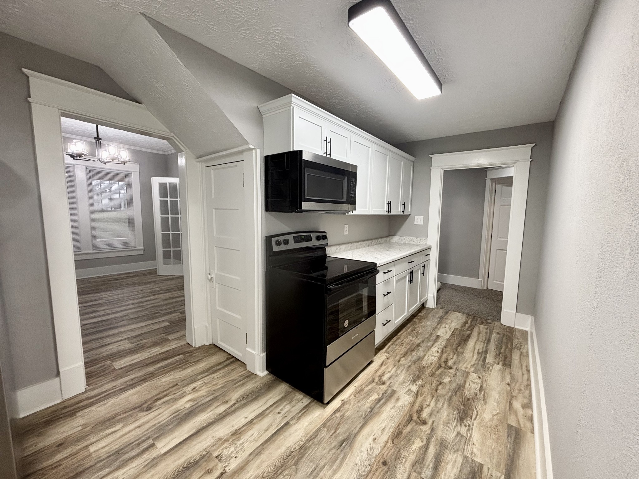 40 Line Street Cadiz, KY 42211 - Photo 12 of 53 a kitchen with stainless steel appliances granite countertop a stove a sink and a refrigerator