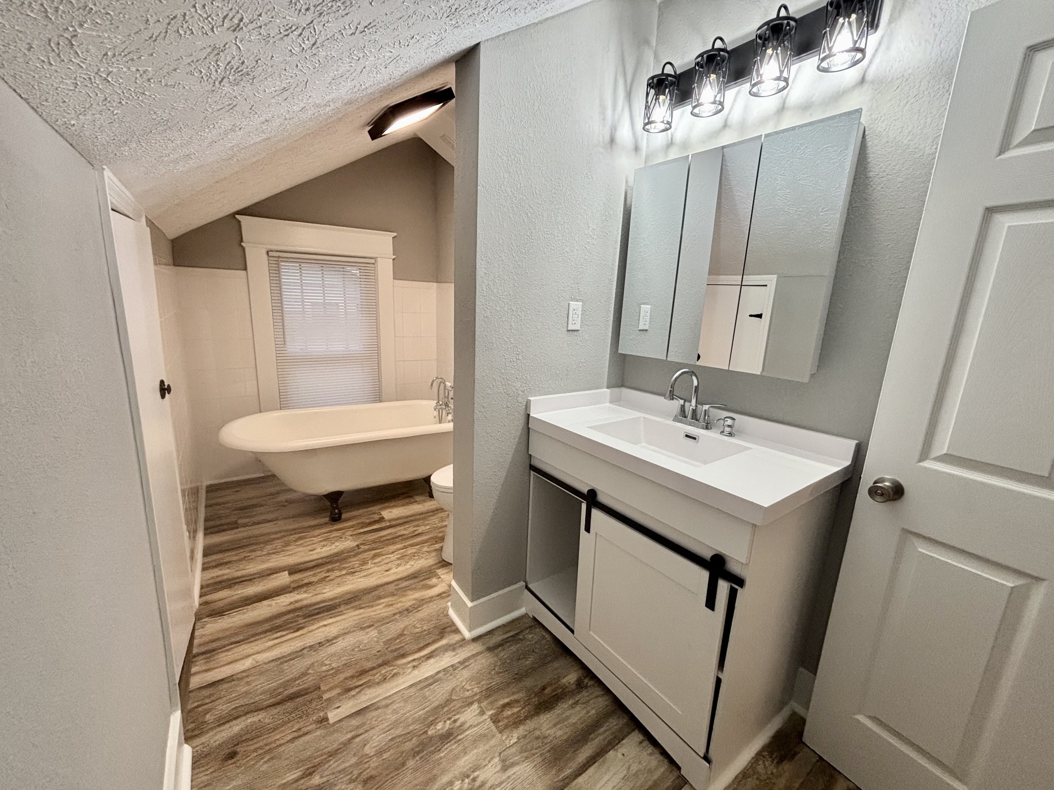 40 Line Street Cadiz, KY 42211 - Photo 29 of 53 a bathroom with a sink a toilet and mirror