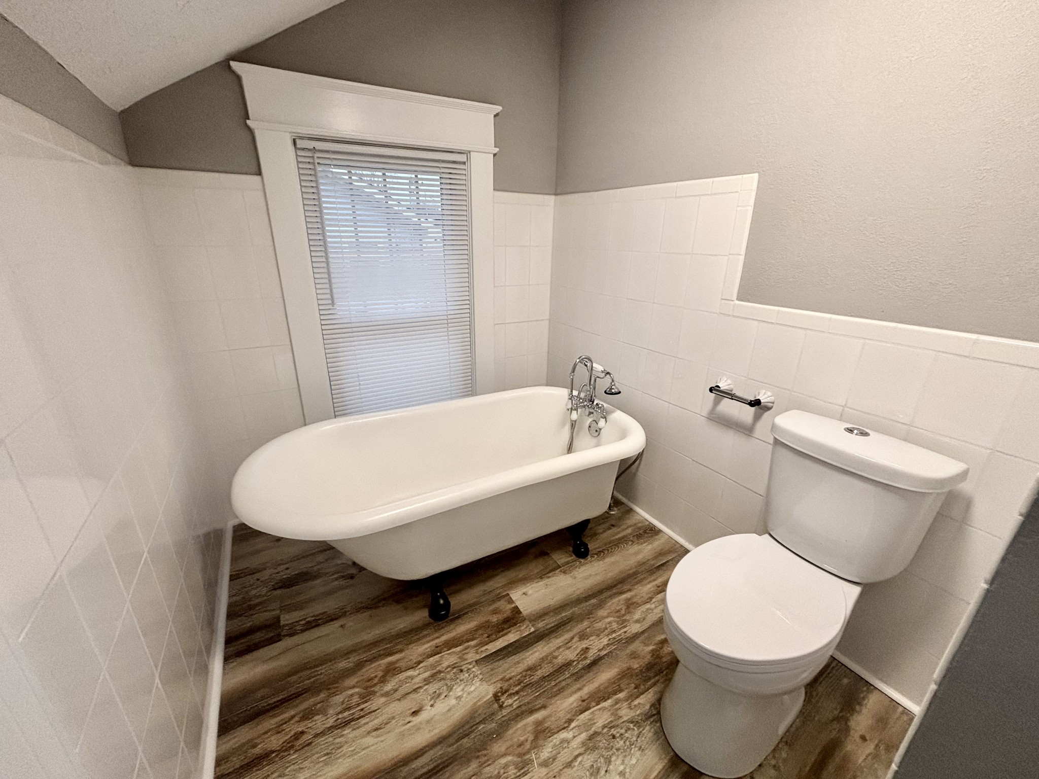 40 Line Street Cadiz, KY 42211 - Photo 30 of 53 a white toilet sitting next to a bathroom sink