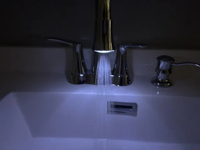 an empty room with fireplace fan and windows