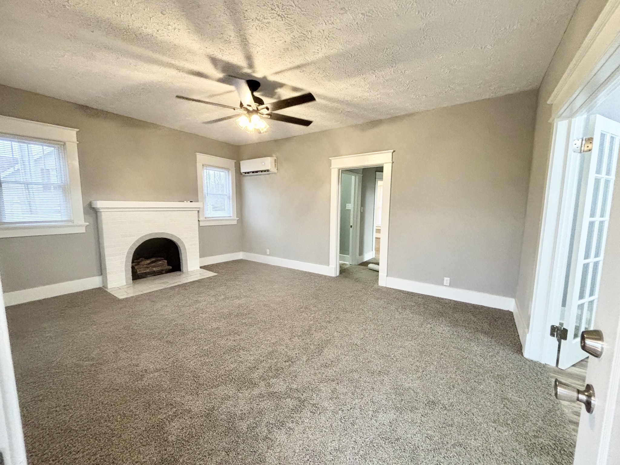 40 Line Street Cadiz, KY 42211 - Photo 36 of 53 an empty room with fireplace fan and windows