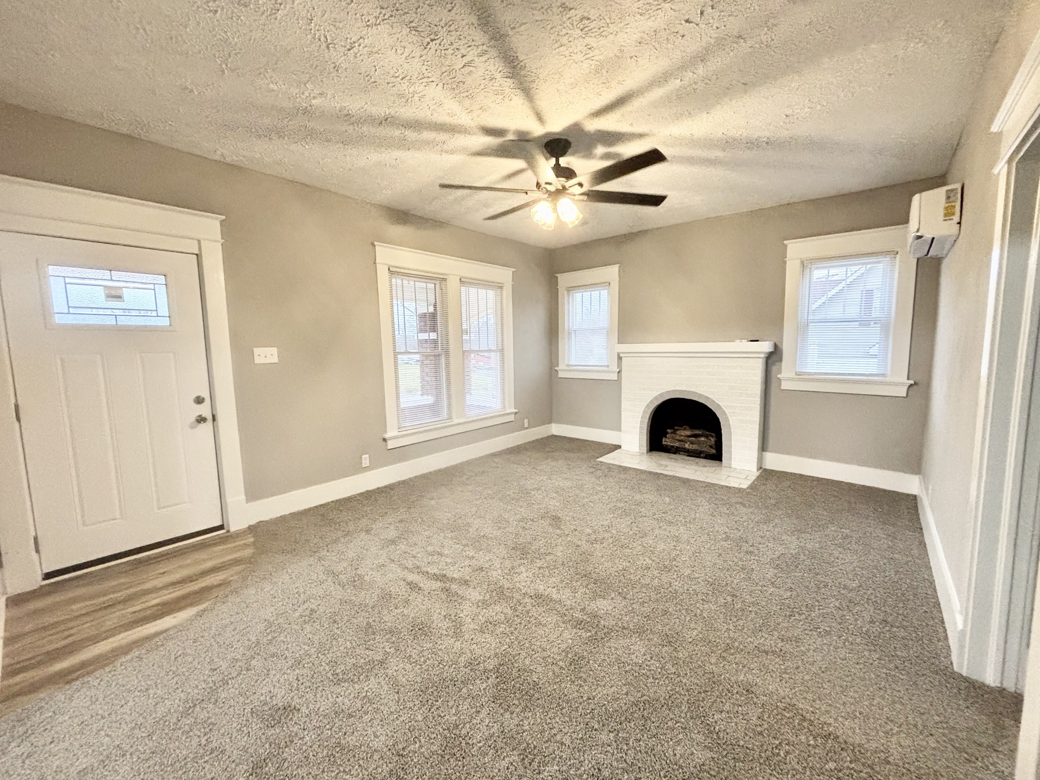 40 Line Street Cadiz, KY 42211 - Photo 37 of 53 an empty room with fireplace fan and windows