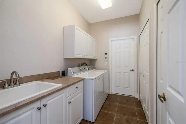 a view of a bathroom with sink and mirror