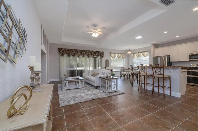 a living room with lots of furniture and white walls
