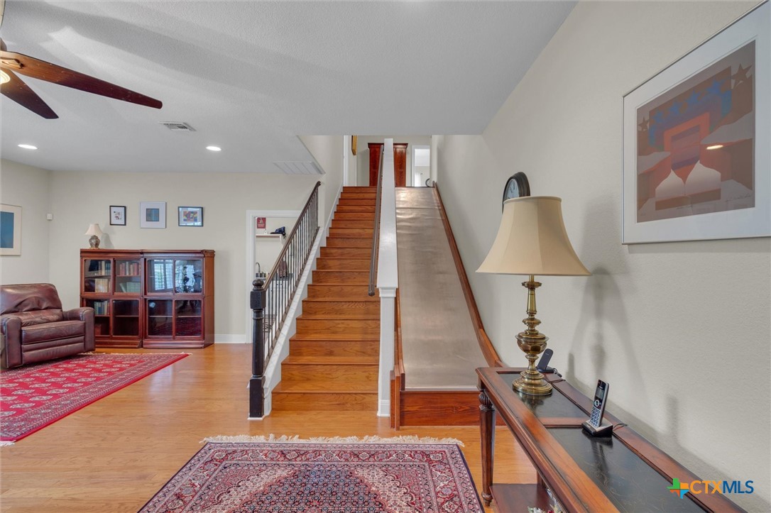 2235 Summit Ridge San Marcos, TX 78666 - Photo 15 of 38 a view of a hallway with workspace and wooden floor