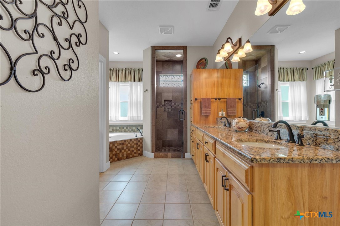 2235 Summit Ridge San Marcos, TX 78666 - Photo 21 of 38 a bathroom with a double vanity sink and a mirror
