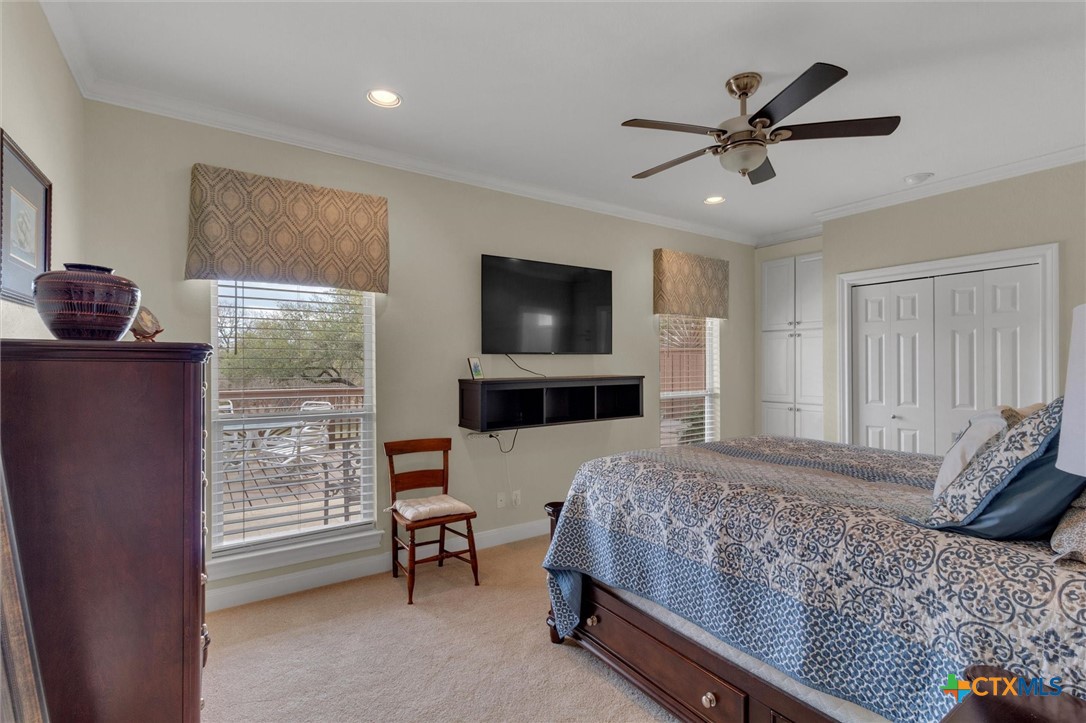 2235 Summit Ridge San Marcos, TX 78666 - Photo 25 of 38 a bedroom with a bed a window and a flat screen television