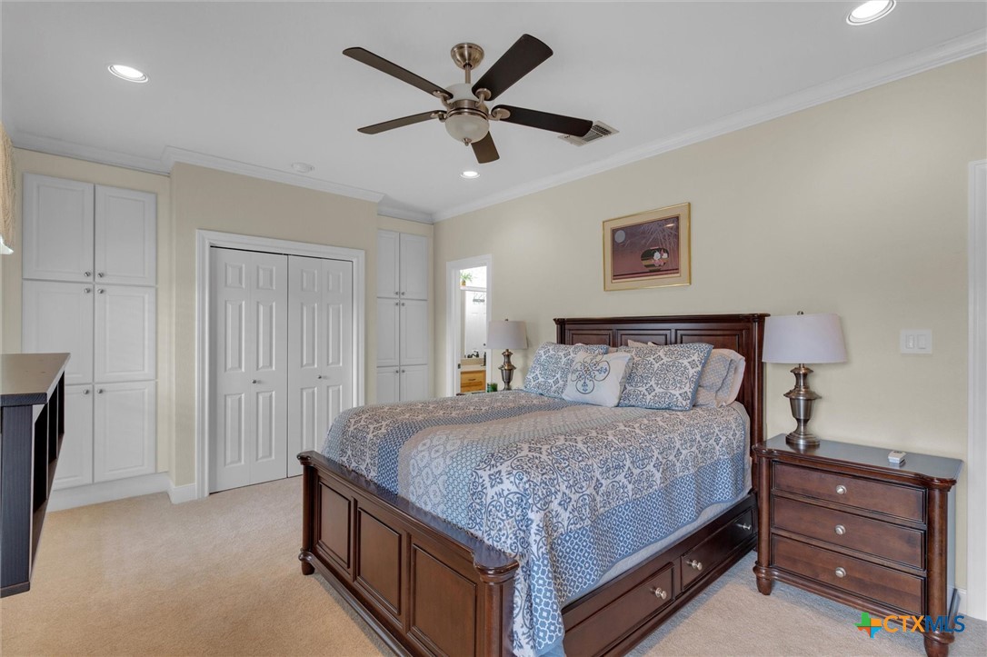 2235 Summit Ridge San Marcos, TX 78666 - Photo 26 of 38 a bedroom with a bed and a ceiling fan