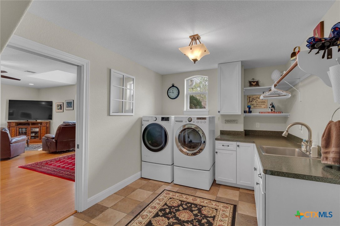 2235 Summit Ridge San Marcos, TX 78666 - Photo 29 of 38 a view of a kitchen with a stove top oven and cabinets