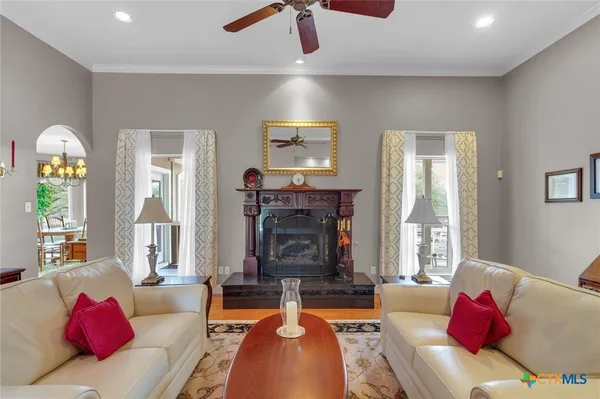 a view of a dining room furniture and a chandelier