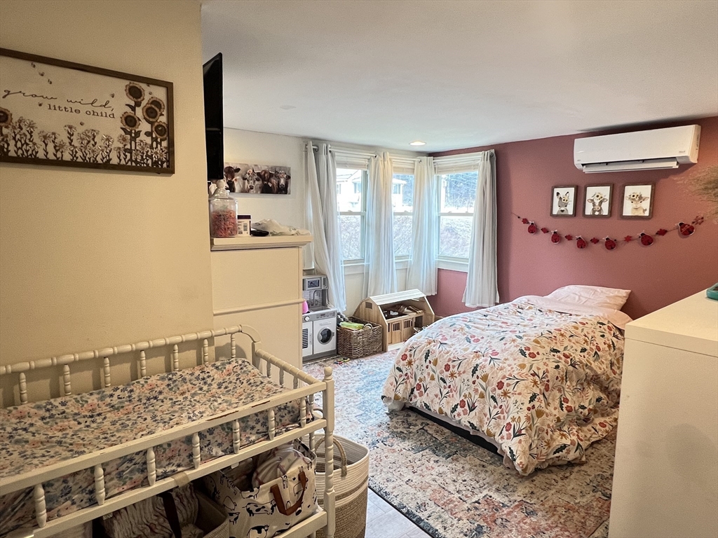 300 Main Road Colrain, MA 01340 - Photo 13 of 41 a bedroom with a bed and wooden floor