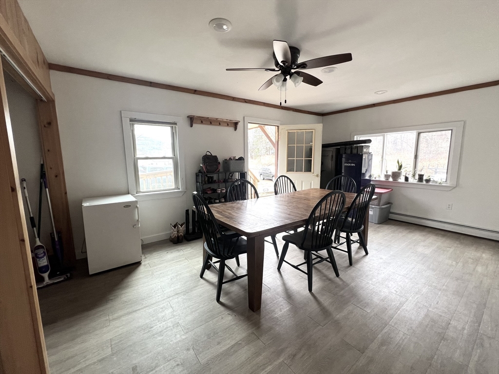 300 Main Road Colrain, MA 01340 - Photo 17 of 41 a view of a dining room with furniture window and wooden floor