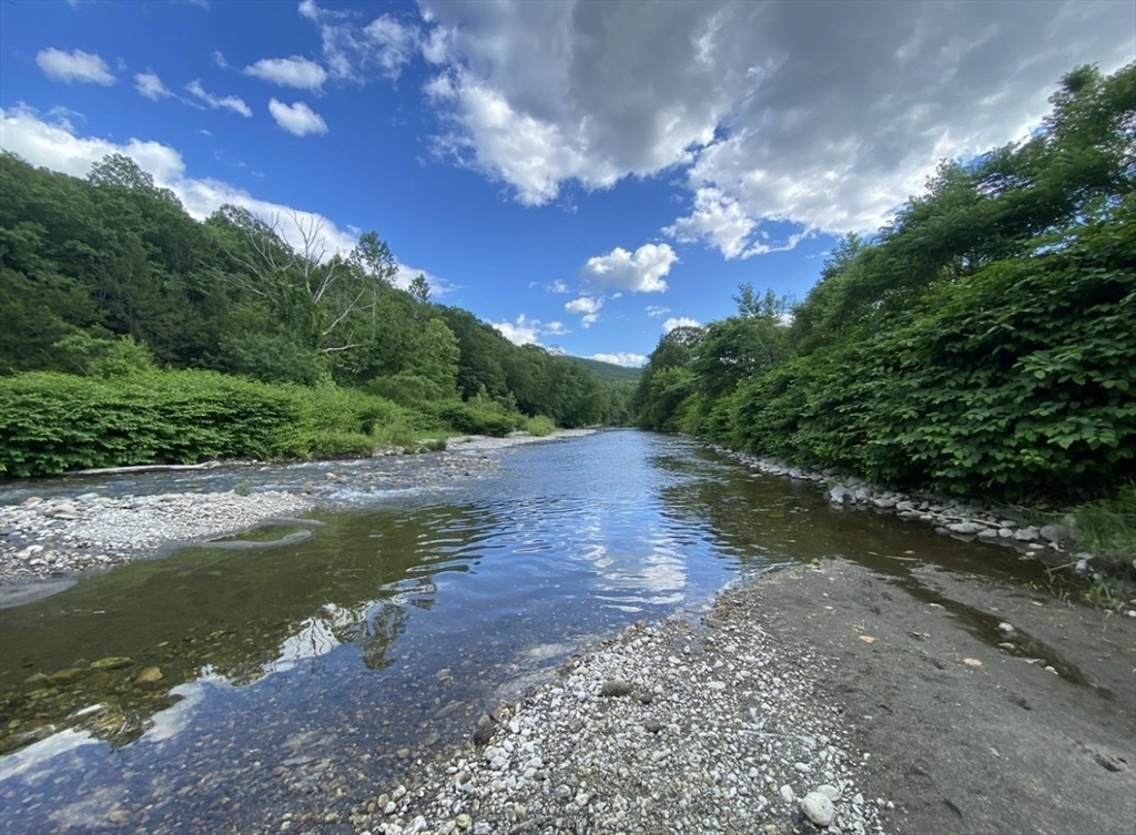 300 Main Road Colrain, MA 01340 - Photo 2 of 41 a view of a lake with a yard
