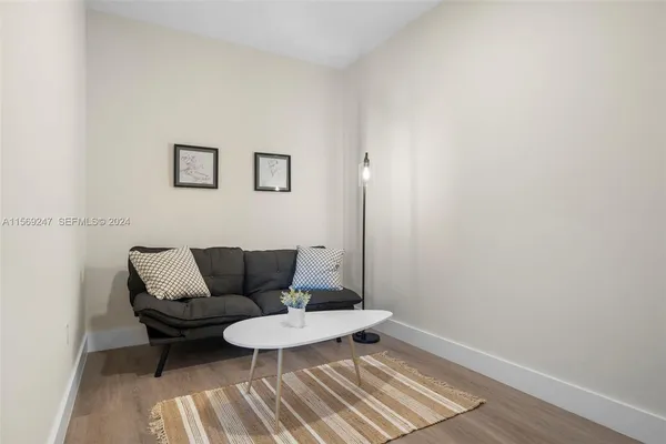 a view of a workspace with furniture