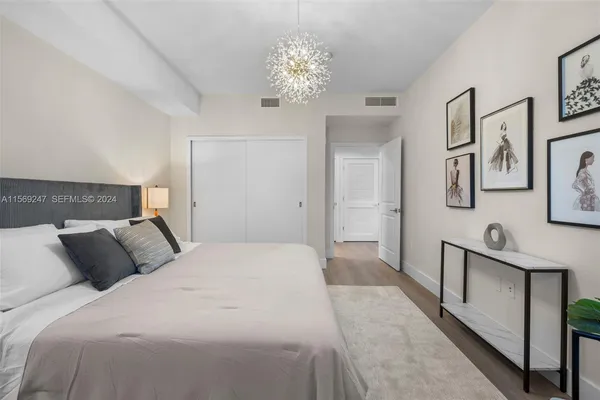 a bedroom with a bed and a table