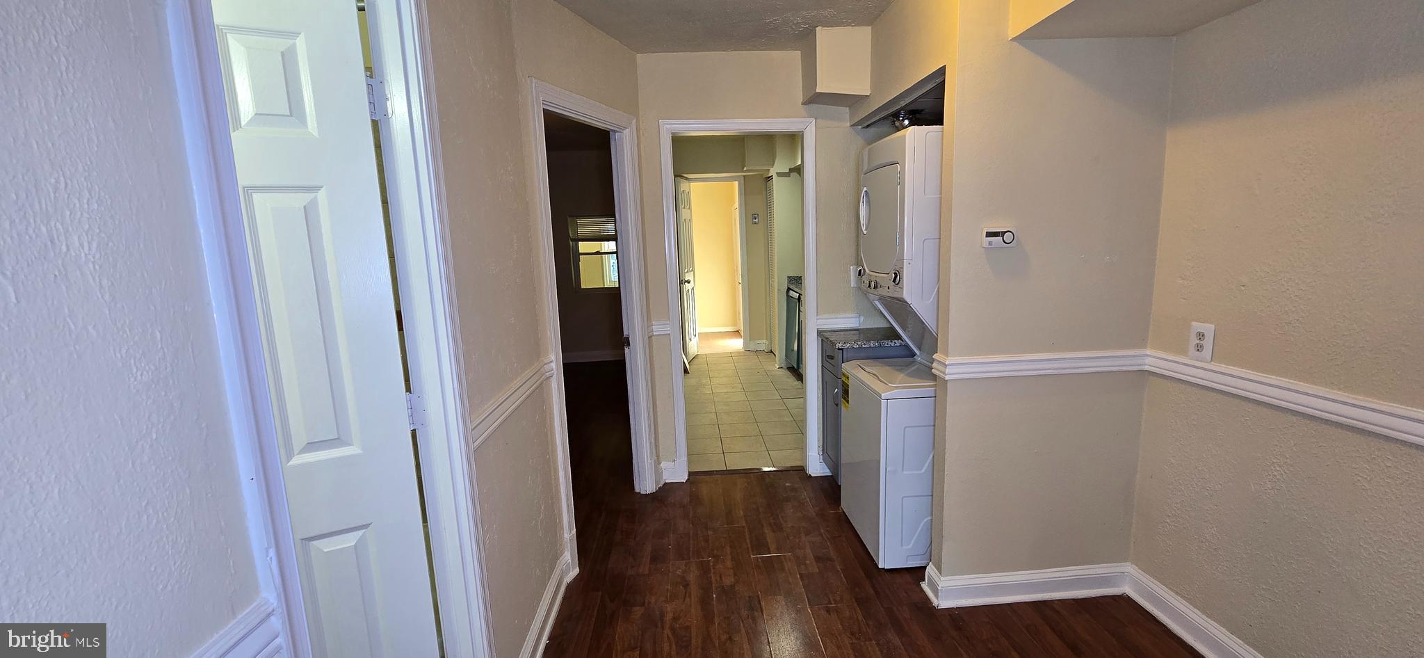1255 Meigs Place Northeast, Unit 3 Washington, DC 20002 - Photo 4 of 13 a view of a hallway with wooden floor and staircase