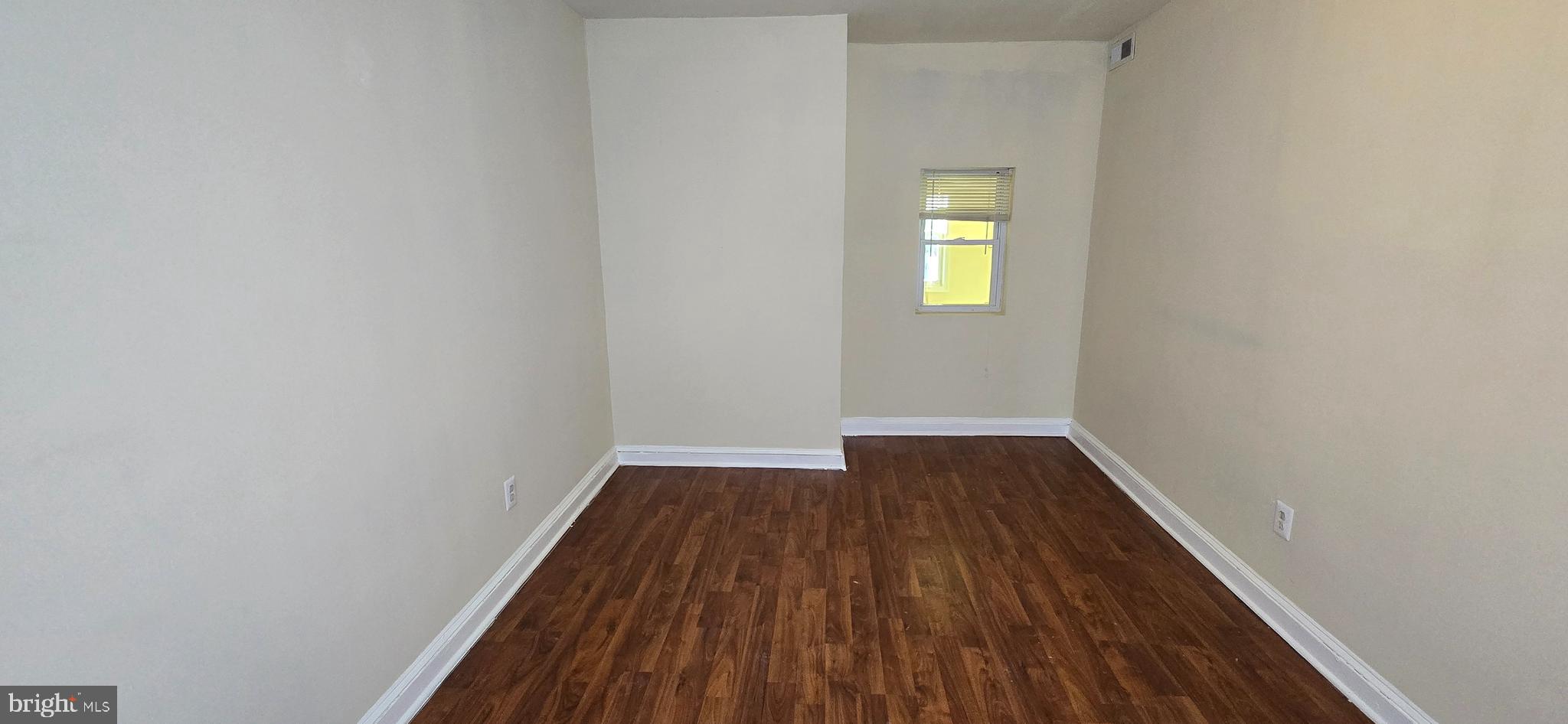 1255 Meigs Place Northeast, Unit 3 Washington, DC 20002 - Photo 7 of 13 a view of a hallway with wooden floor and a window