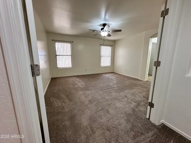 a spacious bathroom with a double vanity sink and mirror