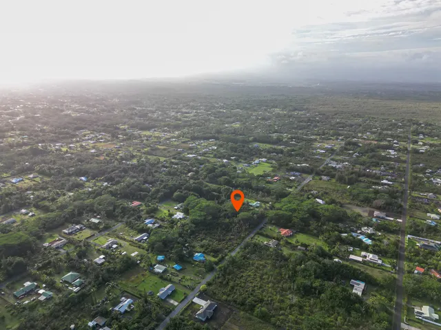 a view of a lake with a house and a forest view