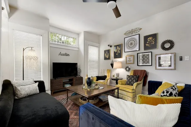 a living room with furniture and a flat screen tv