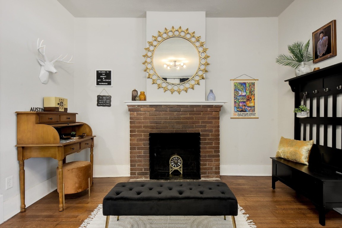 712 East 44th Street, Unit A Austin, TX 78751 - Photo 12 of 40 a bedroom with a fireplace cabinets and a bed