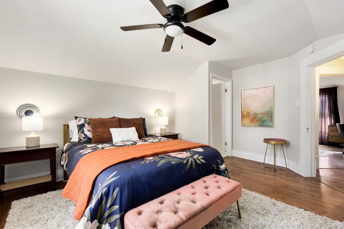 712 East 44th Street, Unit A Austin, TX 78751 - Photo 38 of 40 a bedroom with a bed and a chandelier