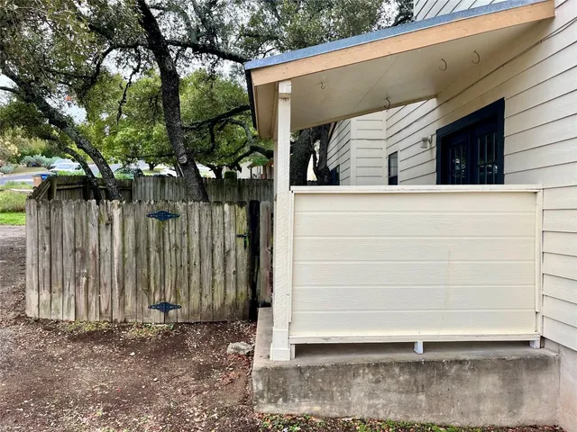 a view of a house with a tree