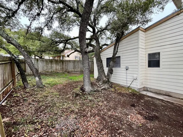 a backyard of a house with lots of green space