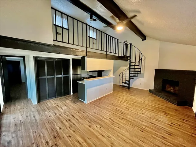 a view of a house with a balcony and stairs