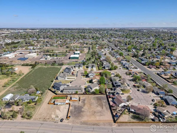 an aerial view of a residential houses with outdoor space
