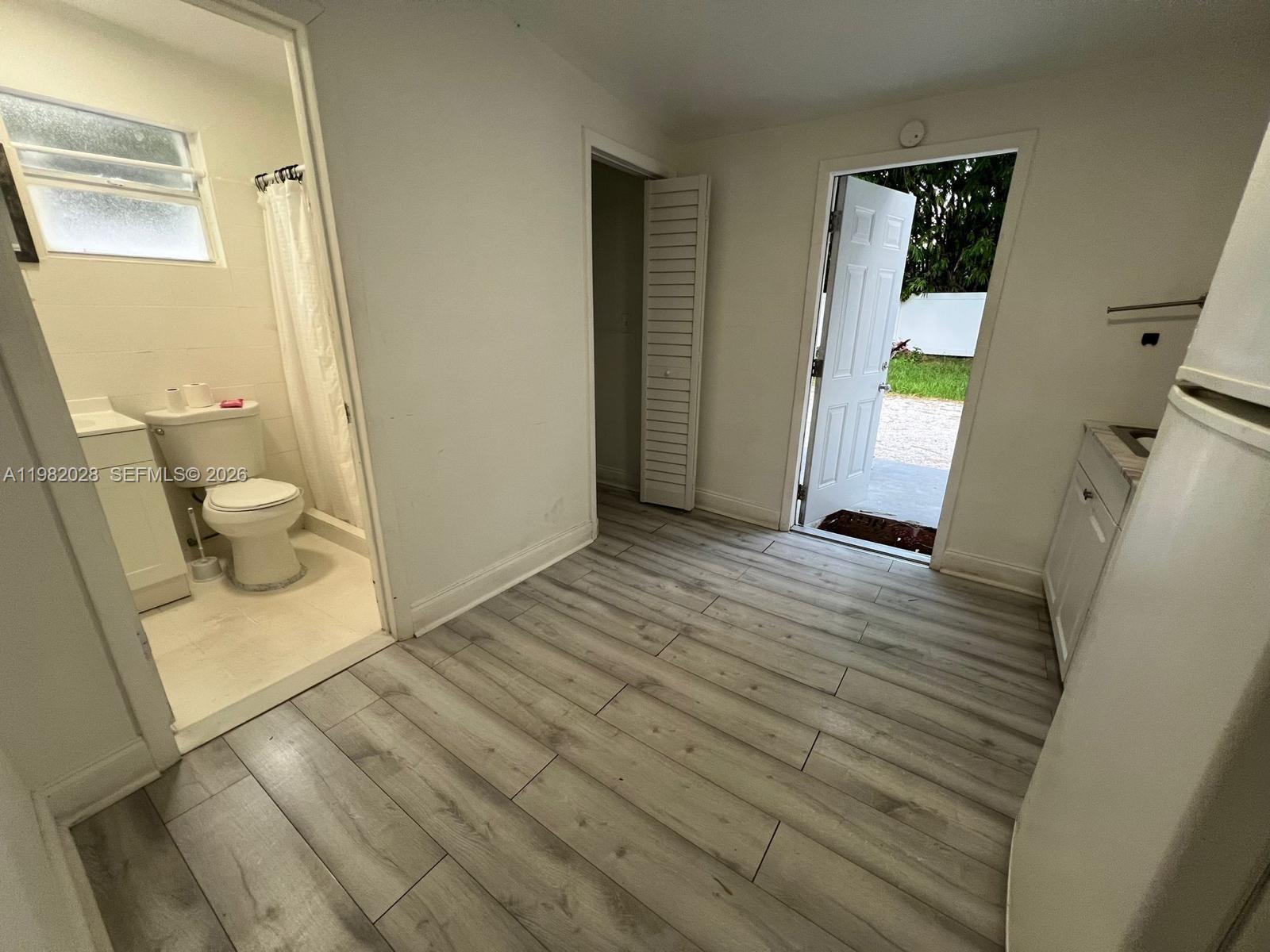 1053 Northeast 149th Street Miami, FL 33161 - Photo 6 of 13 a view of a bathroom from a hallway