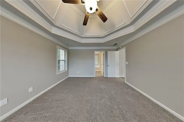 a view of a livingroom with a ceiling fan and window