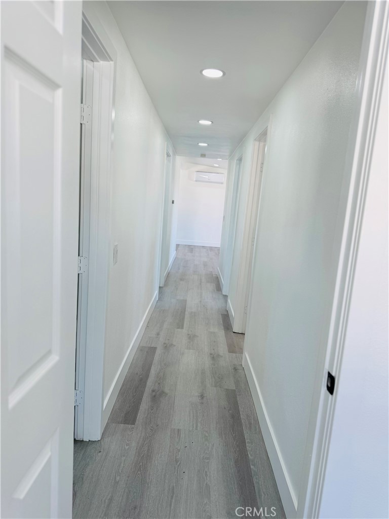 9314 Martha Way Riverside, CA 92503 - Photo 15 of 25 a view of a hallway with wooden floor