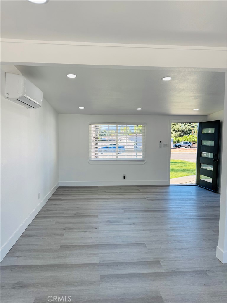 9314 Martha Way Riverside, CA 92503 - Photo 24 of 25 a view of an empty room with window and wooden floor