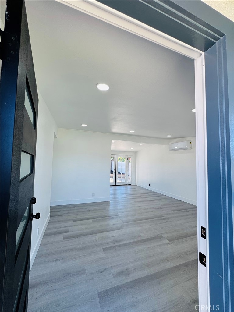 9314 Martha Way Riverside, CA 92503 - Photo 7 of 25 a view of empty room with wooden floor and fan