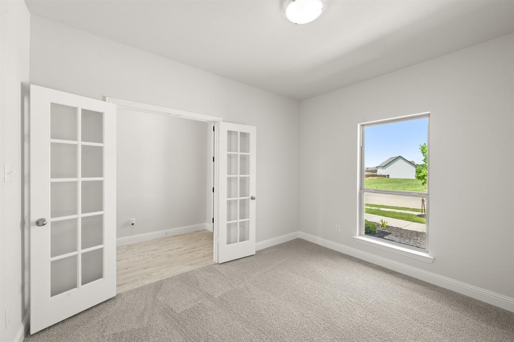228 Shepards Street Godley, TX 76044 - Photo 15 of 27 an empty room with windows