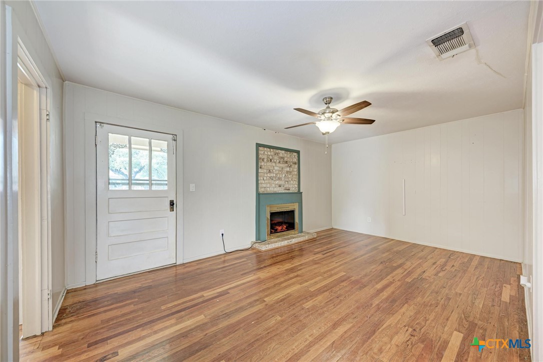 501 North Ridge Street Lampasas, TX 76550 - Photo 11 of 46 a view of a livingroom with a ceiling fan and window