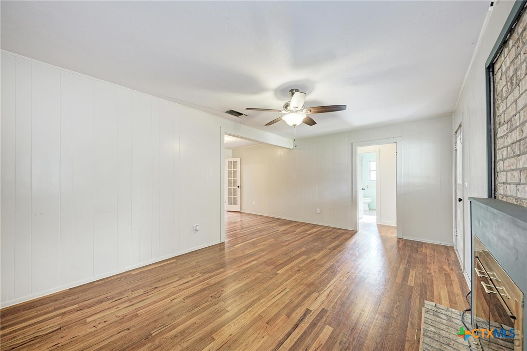 501 North Ridge Street Lampasas, TX 76550 - Photo 13 of 46 a view of an empty room with wooden floor
